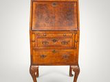 an old wooden desk with drawers and a drawer underneath it