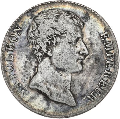 une pièce d'argent représentant la tête d'un homme de profil