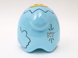 a blue piggy bank with a yellow top on a white background
