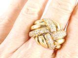 an image of a close up of a person ' s hand with a ring on it