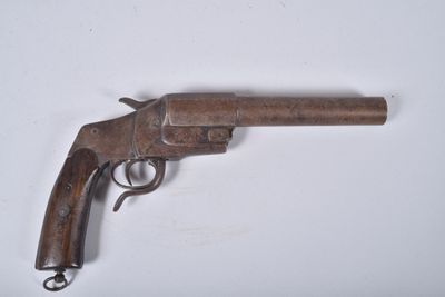 a close up of a gun on a white surface with a white background