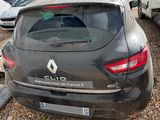 a black car parked in a lot with other cars in the background