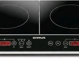 un gros plan sur deux brûleurs situés sur le dessus d'une cuisinière électrique