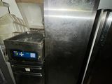 a refrigerator and a dishwasher in a small kitchen
