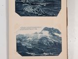 an old book with two pictures of mountains on it