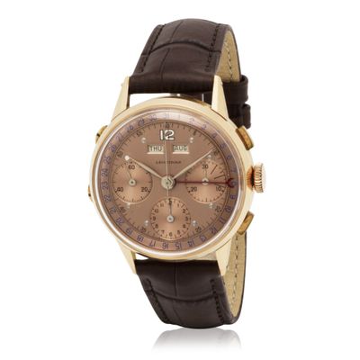 an image of a watch with a brown dial and brown leather strap