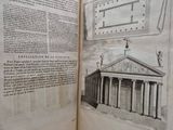 an open book with a drawing of a building on it