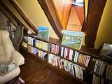 a chair that is in front of a bookshelf