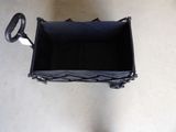 a black basket that has a handle on it