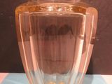 a glass vase that is sitting on a table
