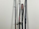 a group of four fishing poles sitting next to each other