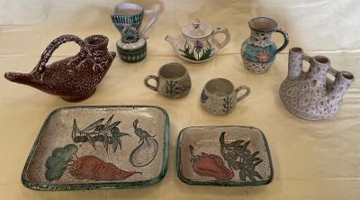 many different types of pottery on the table