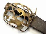 a close up of a sword with a metal handle