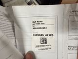 a person holding a piece of paper with a qr code on it