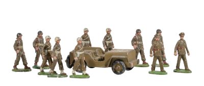 a lot of figurines of military men standing in front of a truck