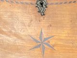 a wooden chest with a star design on it