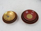 two bowls and a plate sitting on a table