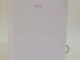 a white air conditioner sitting on a white surface