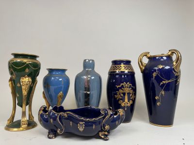 five vases and a bowl sitting on a table