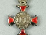 an image of a cross with a crown on top of it