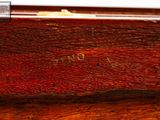 a close up of a piece of wood with writing on it