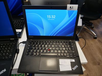 two laptops that are sitting on a table