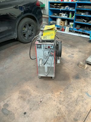 a machine that is sitting on the ground in a garage
