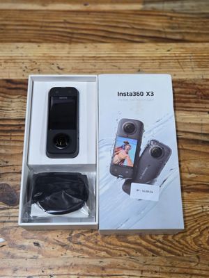 a box with a camera inside of it on a table
