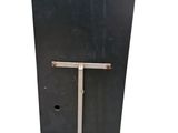 a black box with a metal frame on a stand