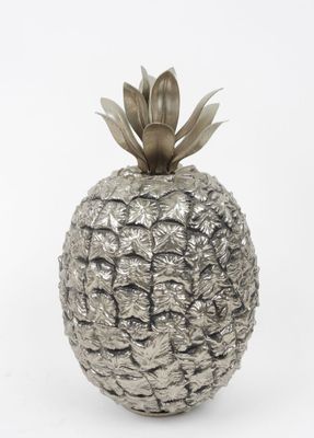 a silver pineapple shaped vase on a white background