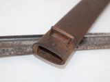 a pair of old tools on a white surface