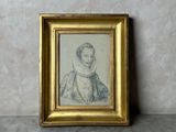 a picture of a picture of a woman in a gold frame