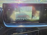 a picture of a car ' s rear view mirror with a camera on it