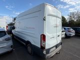 a white van that is parked in a parking lot