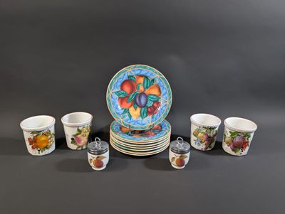 many cups and saucers that are sitting on a table