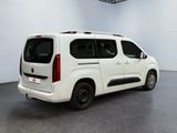 a picture of a white van parked inside of a building