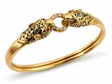 un bracelet en or orné de deux léopards et de diamants