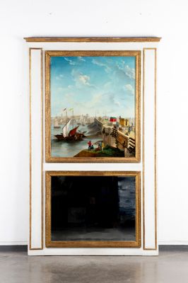 deux tableaux accrochés au mur d'une pièce dotée d'une cheminée