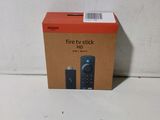 a box with a remote on it sitting on the floor