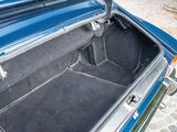 a trunk of a blue car with its doors open
