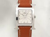 an image of a close up of a watch on a white surface