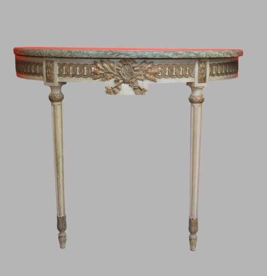 a small table with a marble top on a gray background