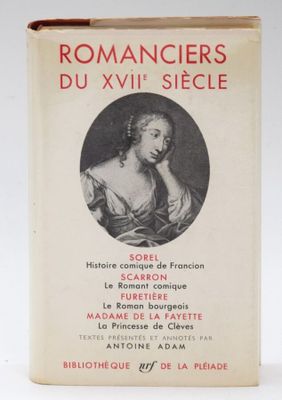an old book with a picture of a woman in a dress