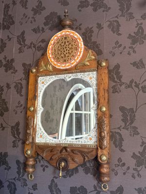 a mirror on the wall above a sink in a bathroom