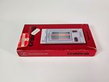 an old nintendo game console sitting on top of a white table