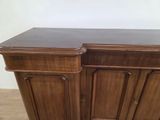 a wooden cabinet that has two doors on it