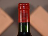 a bottle of wine that is sitting on a table
