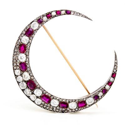 an antique ruby and diamond crescent broochle