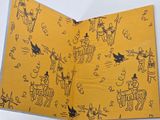 a yellow book with a picture of people on it