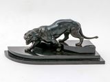 statue of a lion on a marble base on a white background